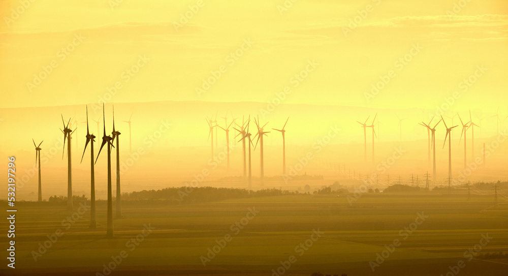 Wind power plant village in the foggy yellow autumn Wind power plant village in the foggy yellow autumn