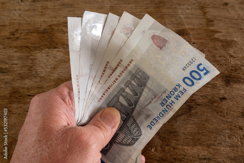Canvas Print Copenhagen, Denmark A hand with 500 krone notes.