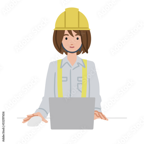 デスクで座ってPCを使っている工事現場の女性