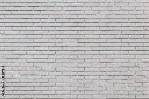 Background image striped brick wall painted white, visible fine textures.