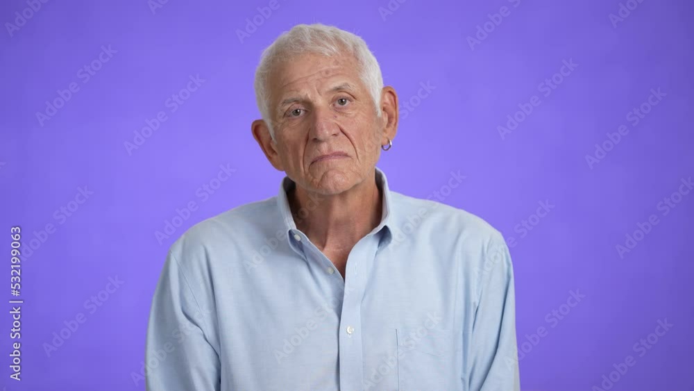 Portrait of a senior old man with gray hair looking at the camera. Happy elderly man smiling. Grandpa is happy to live, a healthy lifestyle. Close-up Portrait of a senior old man with gray hair looking at the camera. Happy elderly man smiling. Grandpa is happy to live, a healthy lifestyle. Close-up