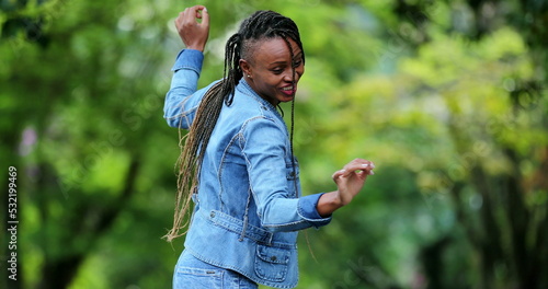 Hispanic black woman dancing outside, female dancer in street