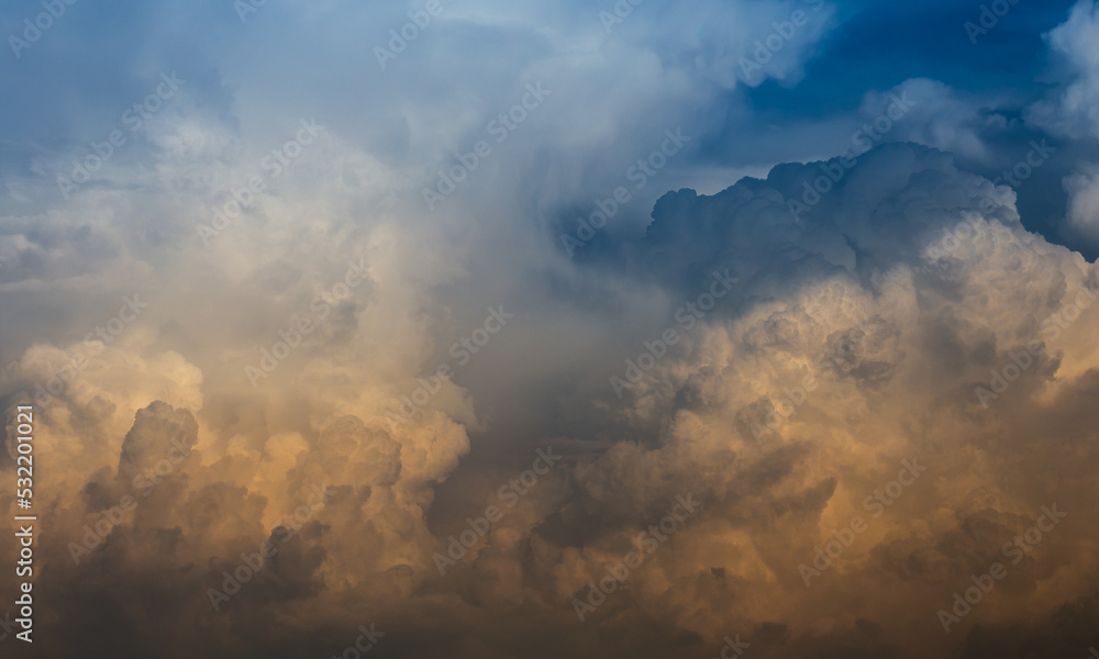 Fototapeta premium Vibrant and Fluffy Storm Clouds during a Sunset, Portugal.