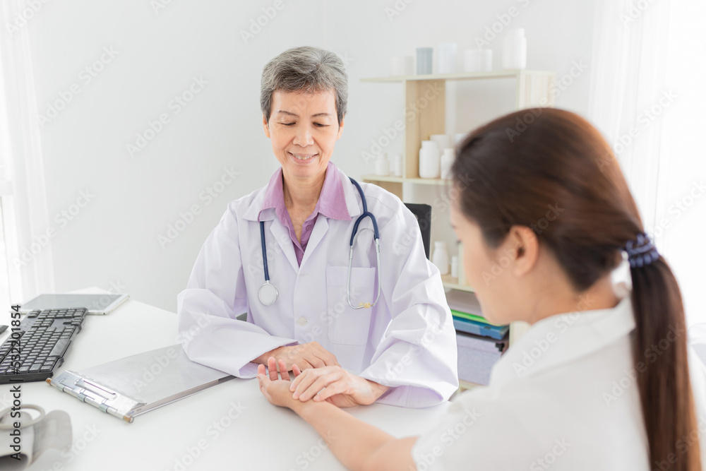 asian doctor use hand screening pulse rate and vital sign of patient, doctor treatment patient in hospital, adult health check up , they talking about disease symptom asian doctor use hand screening pulse rate and vital sign of patient, doctor treatment patient in hospital, adult health check up , they talking about disease symptom