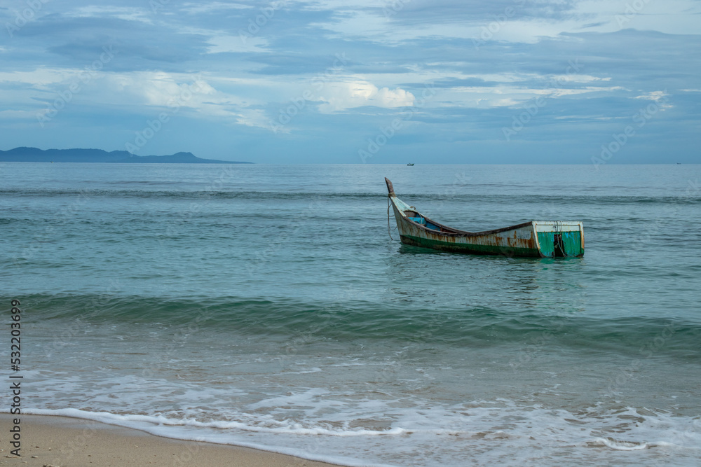 Fototapeta premium The boat is parked on the white sand beach, Aceh Besar, Aceh, Indonesia.