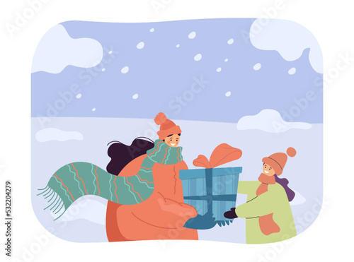 Mother and daughter in warm clothes holding gift box together. Woman and girl standing with present in snowy weather flat vector illustration. Winter holidays, family, love, care concept for banner