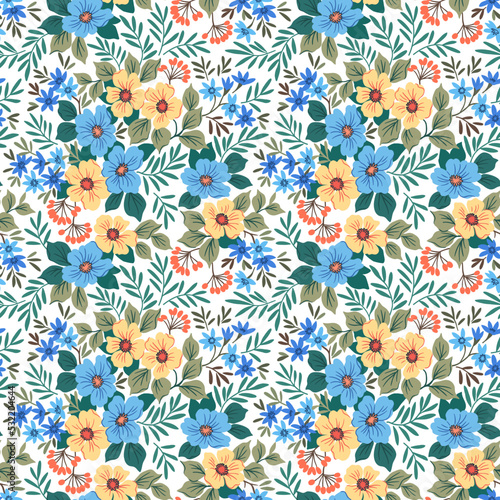 Beautiful floral pattern in small abstract flowers. Small pink and blue flowers. White background. Ditsy print. Floral seamless background. The elegant the template for fashion prints. Stock pattern.