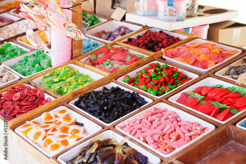 Sweets of many types and colors in a medieval market