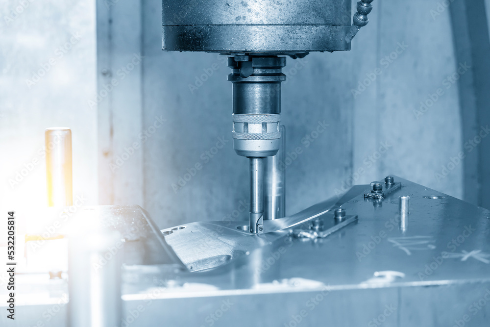 Close up scene the CNC milling machine rough cutting the injection mold parts by indexable tools. Close up scene the CNC milling machine rough cutting the injection mold parts by indexable tools.