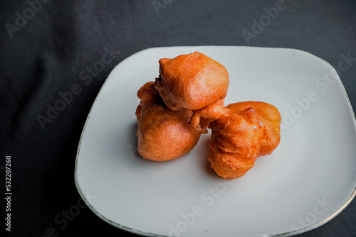 Orang-orang cake is a typical snack from Indonesia. Made from a mixture of wheat flour and bananas, then fried. photo