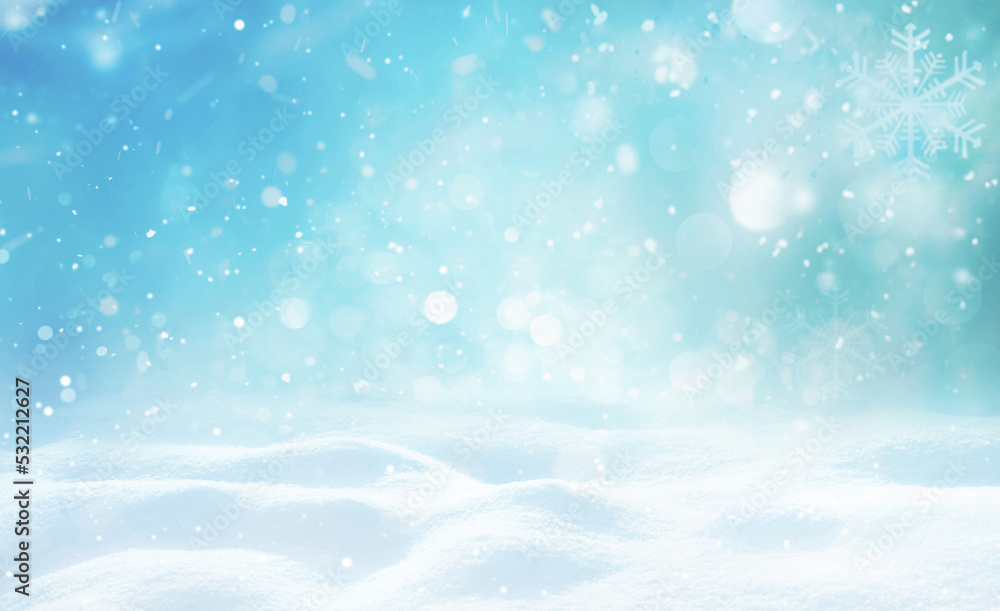 Beautiful background image of small snowdrifts, falling snow and snowflakes in white and blue tones.