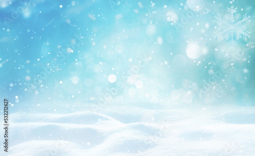 Beautiful background image of small snowdrifts, falling snow and snowflakes in white and blue tones. © Laura Pashkevich