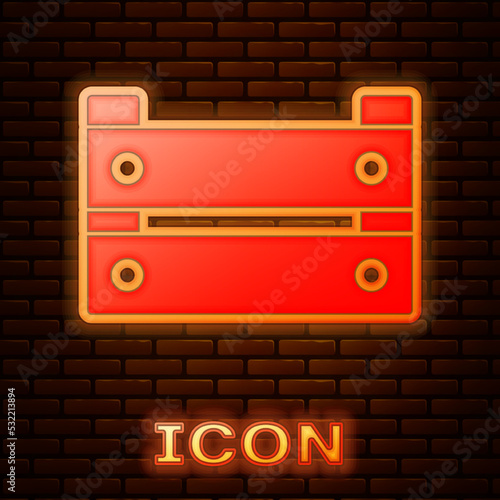 Glowing neon Wooden box icon isolated on brick wall background. Grocery basket, storehouse crate. Empty wooden container for vegetables, products. Vector