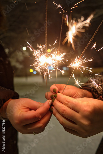 Christmas and happy new year sparkler in hand