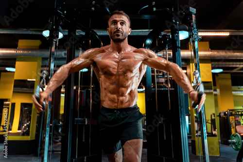 Bodybuilder in the gym pumping muscle and burning fat.