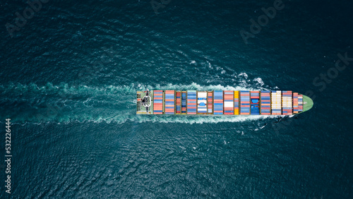 container ship to import export marine goods to dealers and consumers across the pacific and around the world, businesses and industries Ocean freight forwarding, processing blue tone cinematic © SHUTTER DIN