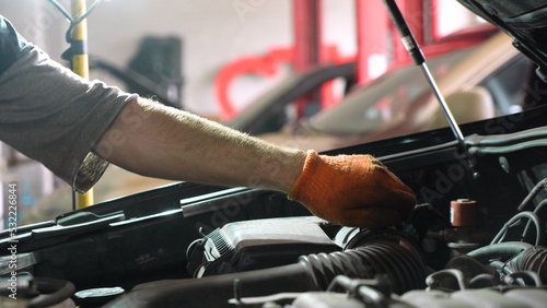 Auto mechanic repairs car engine. car service. auto repair shop.