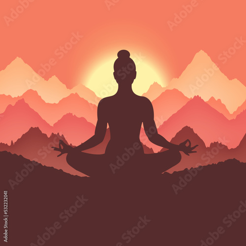Silhouette of a woman meditating in the mountains at sunrise 