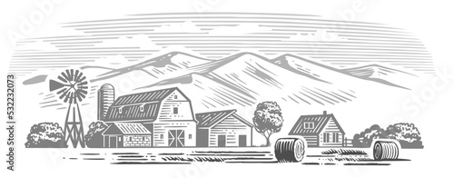 Field with haystacks. Farming landscape with mountain