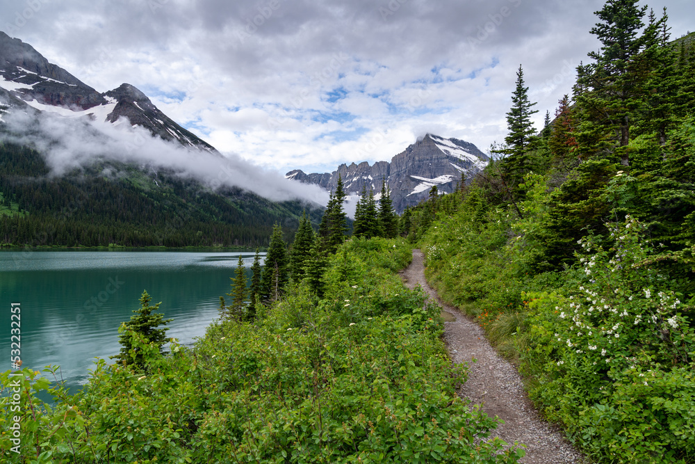 Grinnell Glacier trail in Glacier National Park Montana, with Lake Josephine in photo