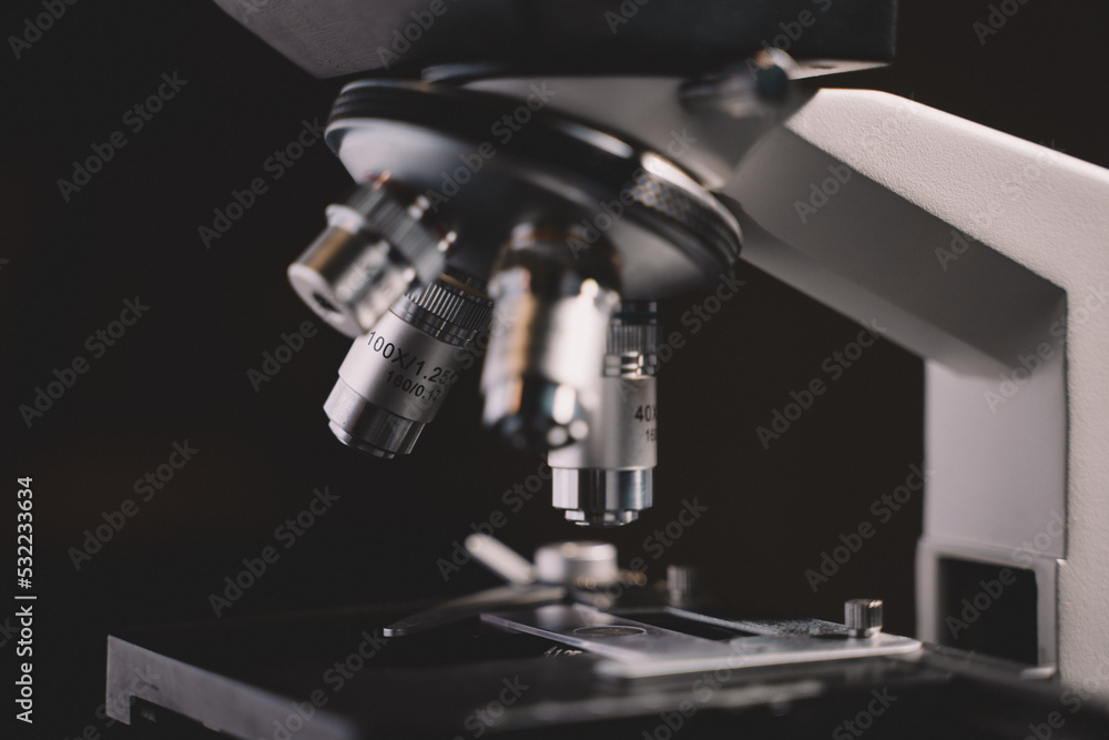 Microscope in laboratory science closeup research. Laboratory of biology by biotechnology for analysis, experiment, education and test. Microscope in laboratory science closeup research. Laboratory of biology by biotechnology for analysis, experiment, education and test.