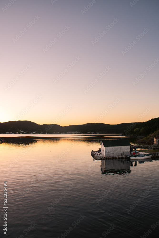Tranquil sunset on wharf of fishing community in Newfoundland, Canada.