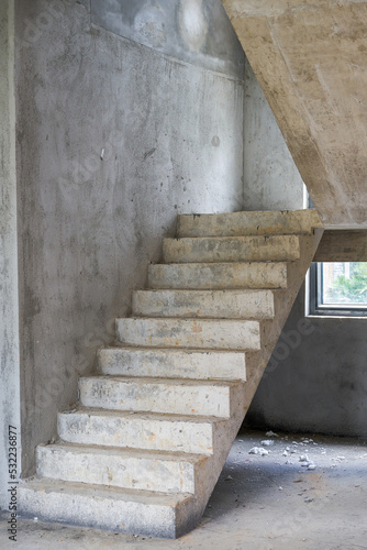 Close-up of stairs in rough house of unrenovated villa photo