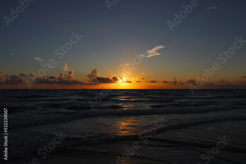 beautiful tropical sunrise with clouds and sunset on the sea © Daniel