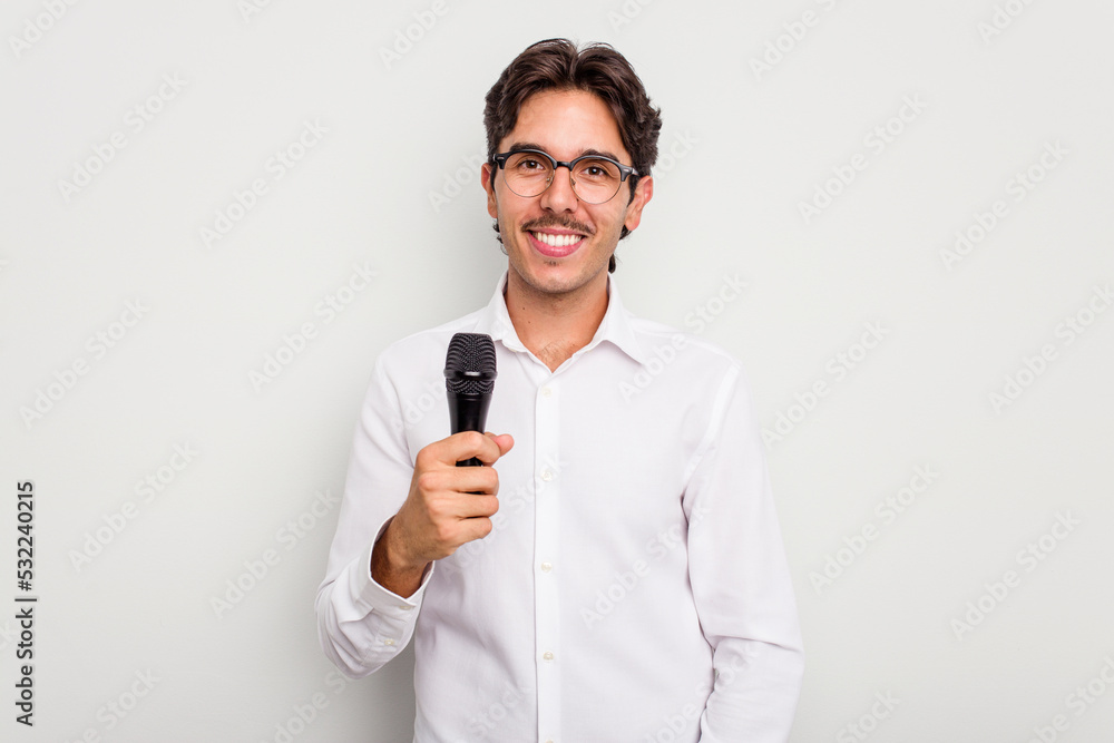 Young hispanic singer man isolated on white background happy, smiling and cheerful. Young hispanic singer man isolated on white background happy, smiling and cheerful.