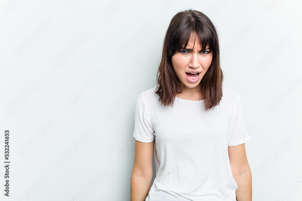 Young caucasian woman isolated on white background shouting very angry, rage concept, frustrated. Young caucasian woman isolated on white background shouting very angry, rage concept, frustrated.