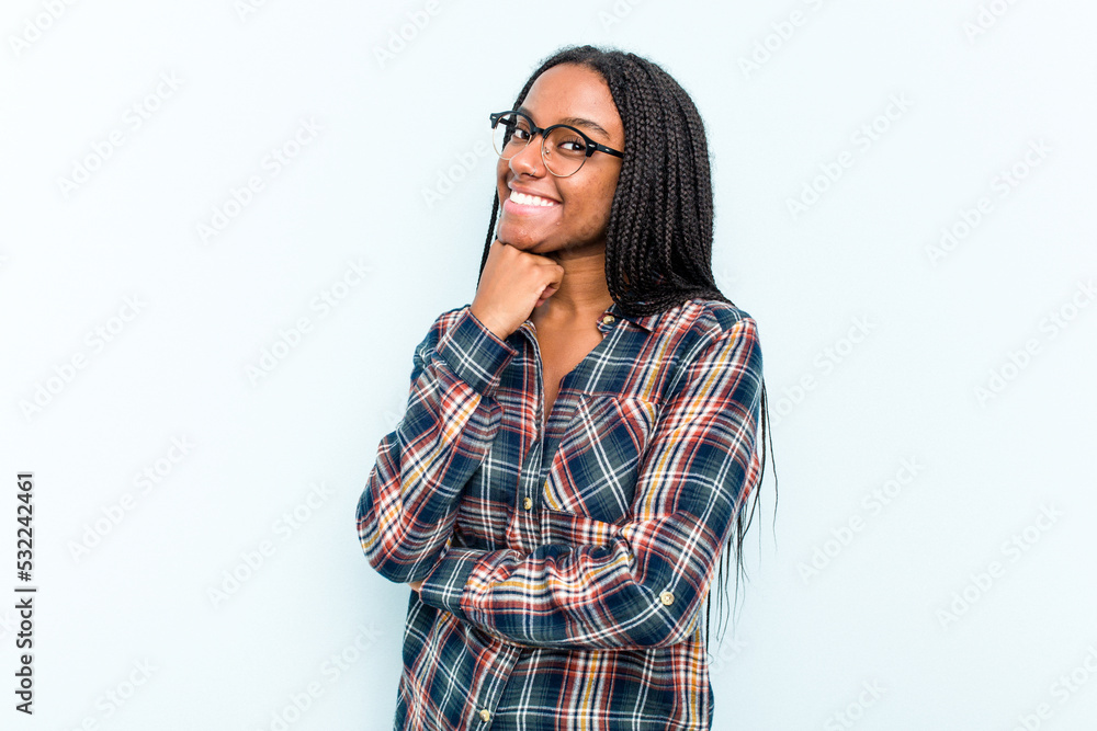 Young African American woman with braids hair isolated on blue background smiling happy and confident, touching chin with hand.
