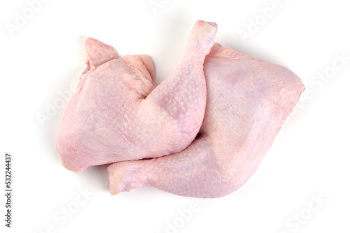 Raw chicken leg quarters, isolated on white background.