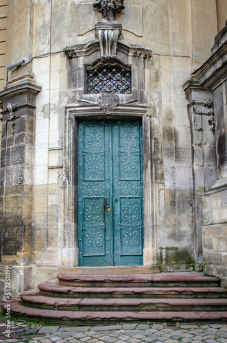 Ancient iron doors of a stone temple. © Denis Rozhnovsky