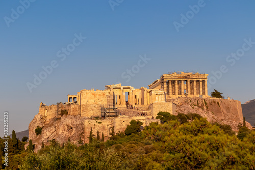 Panoramic view during sunset of the Parthenon of the Acropolis seen from Filopappou Hill, Athens, Attica, Greece, Europe. Ruins of Ancient Greek temples, birthplace of democracy and civilization