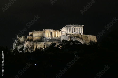 Panoramic view at night of the illuminated Parthenon of the Acropolis seen from Pnyx Hill, Athens, Attica, Greece, Europe. Ruins of Ancient Greek temples, birthplace of democracy and civilization