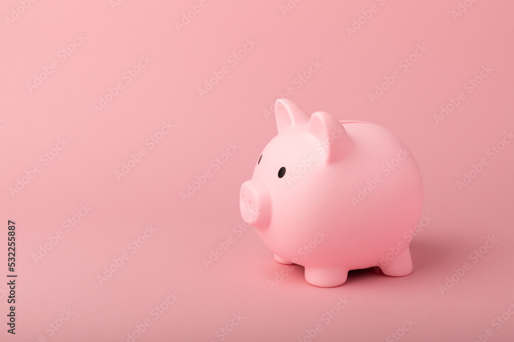 Piggy bank on a pink background.The concept of investment and saving money.Investments.Place for milking text. Place to copy. mockup