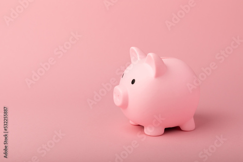 Piggy bank on a pink background.The concept of investment and saving money.Investments.Place for milking text. Place to copy. mockup