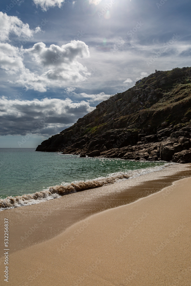 The idyllic beach at Porthcurno in Cornwall, on a sunny day
