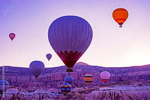 takeoff of hot air balloons at sunrise in the circumference of Cappadocia, horizontal