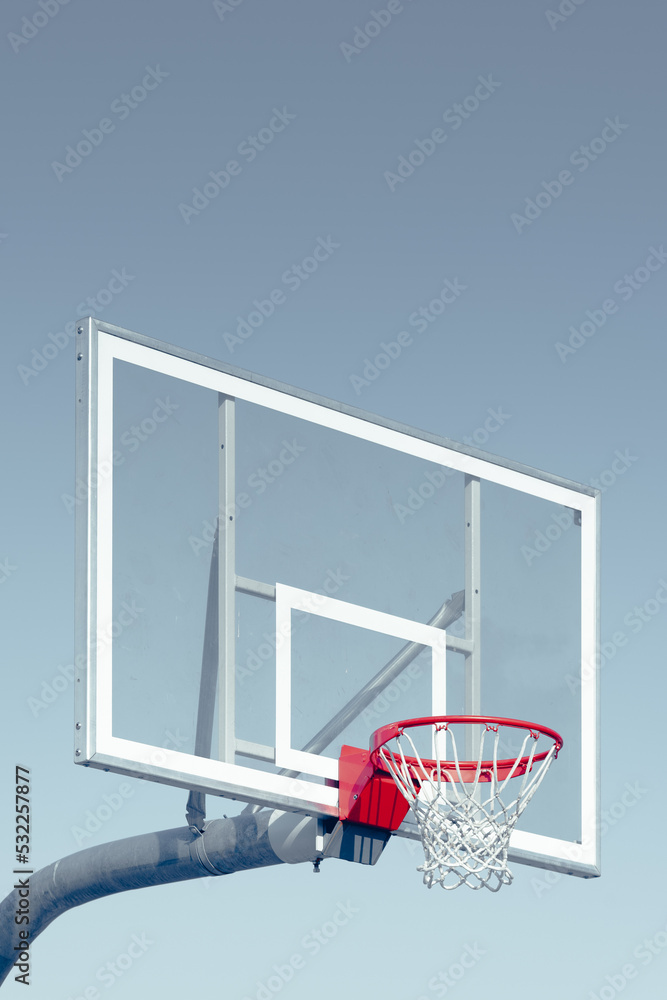 basketball hoop against blue sky vintage film edit