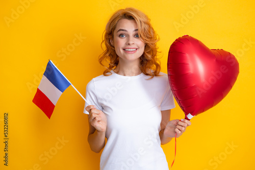 France flag. Happy woman holding flag of France and red heart balloon, immigration and travelling in Europe. France school or university concept.