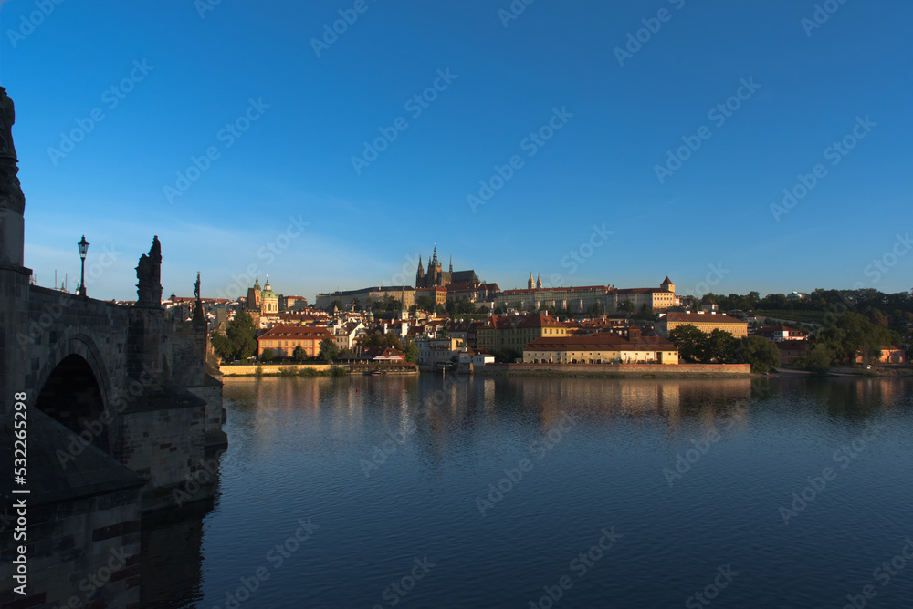 Prague panorama in a summer morning. Near Charles Bridge with a view of Prague Castle.