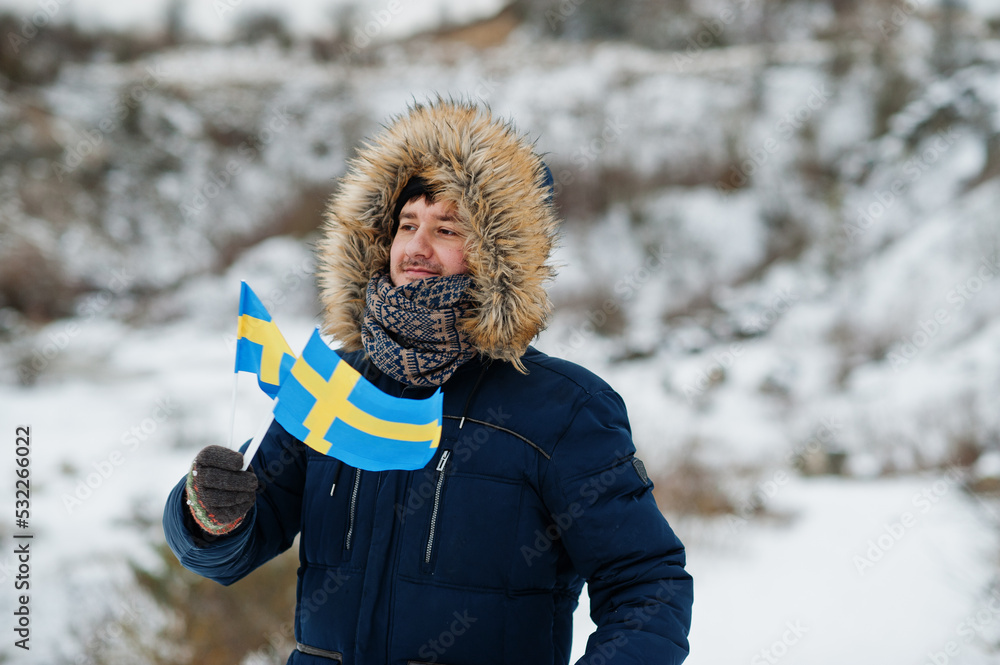 Scandinavian man with Sweden flag in winter swedish landscape. AS Photo Family Foto Poster Wandbilder bei EuroPosters