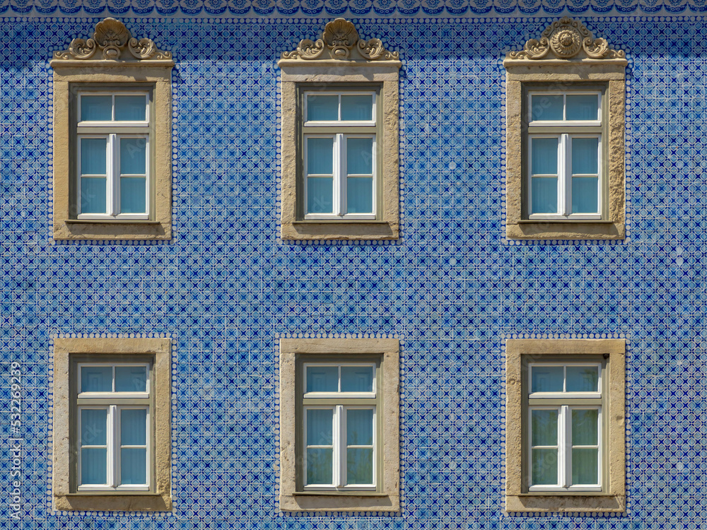 Traditional Portuguese houses with windows frame, Seamless pattern of building wall with blue colour made from square ceramic vintage tiles, Architecture background, Lisbon is capital city of Portugal