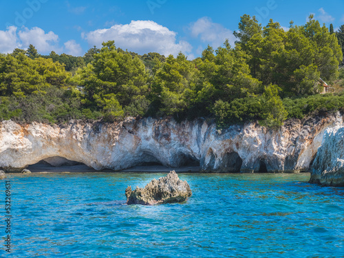 Fototapeta Naklejka Na Ścianę i Meble -  Beautiful beach with stone caves in Greece