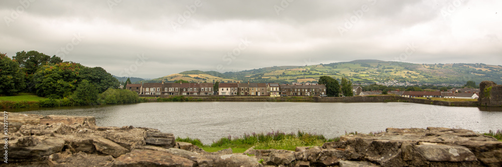 Banner view of a small town across the river in cloudy weather