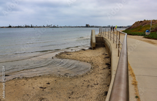 View of stairs for beach access on Sail Bay on the side of the Bayside Walk trail in Mission Bay  California.