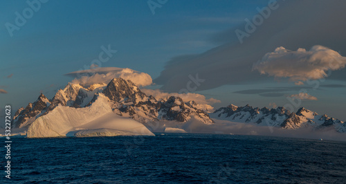 South Georgia Island. Panoramic with Icebergs, mountain, snow, ocean and clouds.