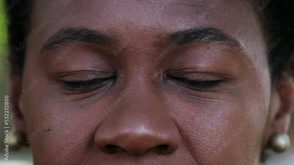 Fototapeta premium African black woman closing eyes in meditation and contemplation