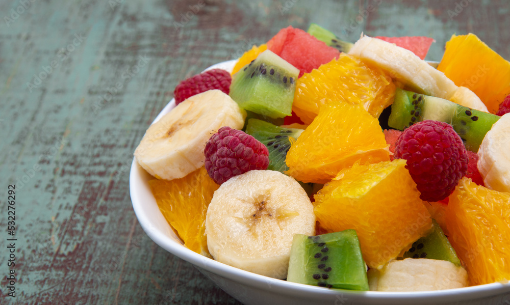 fresh healthy fruit salad on wooden background fresh healthy fruit salad on wooden background
